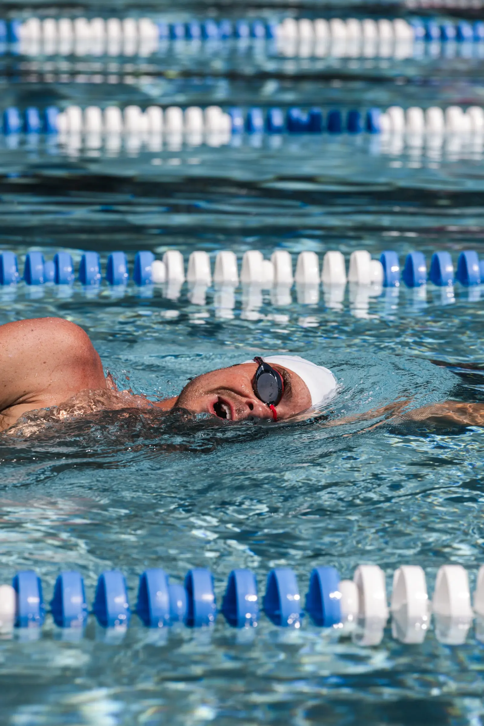 Swimmer doing technique drills in a lane